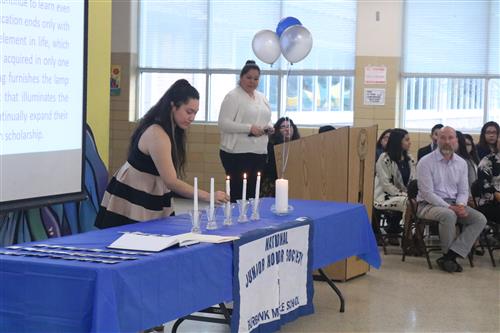 Angelic Sanchez sets down the candle for Scholarship 